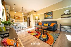 a living room with a couch and a table at Sunset & Lakeview from Castle Turret on The Island in Lago Vista
