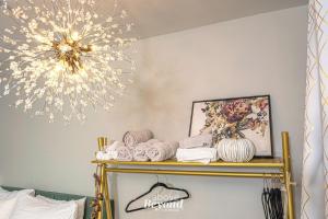a chandelier hangs over a shelf with towels at Glam Jam! - Newly Remodeled Stay in Style! Pets Stay Free in Branson