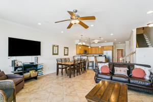 a living room with a couch and a table at 445 Fort Pickens Rd in Pensacola Beach