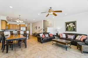 a living room with a couch and a table at 445 Fort Pickens Rd in Pensacola Beach