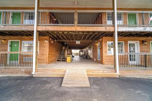 an inside view of a wooden building with a hallway at Modern Moose Free Shuttle to SDC in Branson