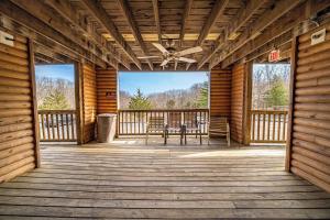 a screened in porch with a table and chairs on it at Modern Moose Free Shuttle to SDC in Branson