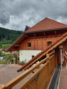 a large wooden building with a gate in front of it at Haus Schober in Windischgarsten