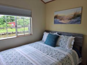 a bedroom with a bed and two windows at Cozy, Private Guest House #5 in Blaine