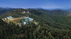 an aerial view of a house on top of a mountain at vishwaram Homestay in Chail