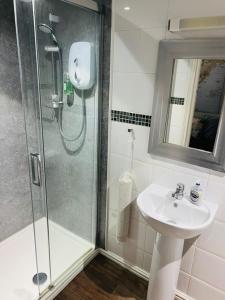 a bathroom with a shower and a sink at The Old Rectory Chicklade in Chicklade +21 photos