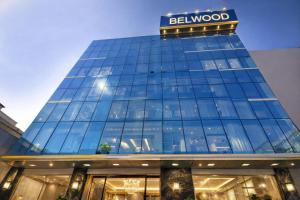 a building with a sign on top of it at Hotel Bellwood Near IGI International Delhi Airport in New Delhi