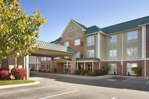 a rendering of the front of a hotel with a parking lot at Country Inn & Suites by Radisson, Camp Springs Andrews Air Force Base , MD in Camp Springs