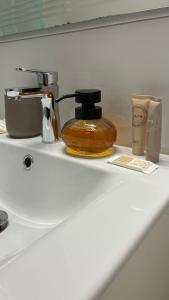 a counter with a coffee maker and cups on it at Champagne Apartments in Portorož +36 photos