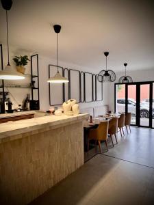a kitchen and dining room with a table and chairs at Hotel tafoukt in Marrakesh