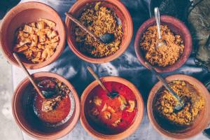 a group of four bowls of food on a table at Rainforest Mountain Escape - Lankagama in Deniyaya