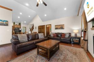 a living room with a couch and a table at Hickory Hideaway with Communal Pool Access in Hollister +28 photos