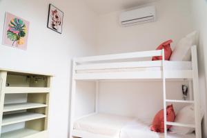 a white bunk bed in a white room at Parnaydisiaque in Parnay