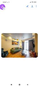 a living room with a couch and a table at Gori Apartaments in Gori