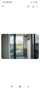 a screenshot of a window with a view of a city at Gori Apartaments in Gori