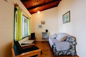 a living room with a couch and a table at Ambleside - 2-Bedroom Cottage #4 in Kawartha Lakes