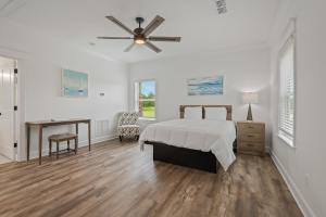 a bedroom with a bed and a ceiling fan at St James Bay Golf & Pickleball Resort in Big Blackjack Landing +64 photos