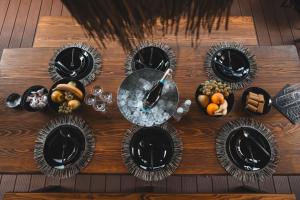 a table with plates of food on it at TULUM luxury suites-SKOPJE in Skopje