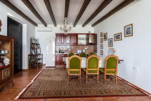 a dining room with a table and chairs at Sunrise House - Swimming Pool in Berat