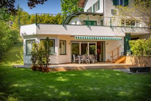 a house with a patio and lawn at Ferienstudio Traunsee in Gmunden