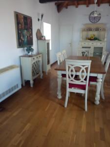 a dining room with a table and chairs at The stone house in Doukádes