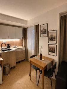 a kitchen and dining room with a table and chairs at Esprit Residences Budapest in Budapest