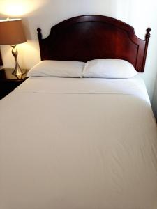Postel nebo postele na pokoji v ubytování Hotel Bon Accueil