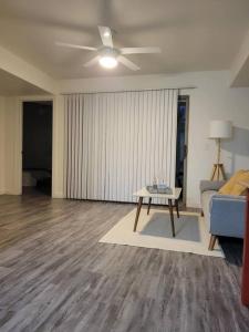 a living room with a couch and a table at Close to ASU campus in Tempe