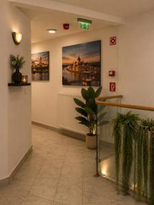 a waiting room with two posters on the wall at Esprit Residences Budapest in Budapest