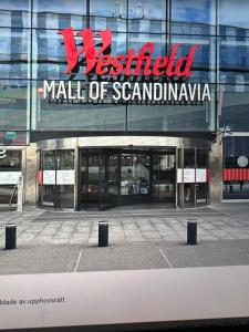 a mall of scania building with a sign on it at Modern Apartment i Solna in Solna
