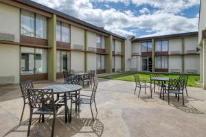 a patio with tables and chairs in front of a building at Best Western Tomah Hotel in Tomah +31 photos