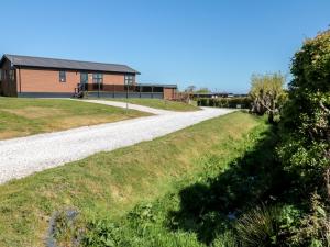 a gravel road leading to a house at Hazel Lodge in Whitby
