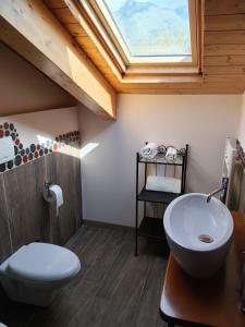 a bathroom with a toilet and a sink and a skylight at Il Finto Pepe di Alessia in Formia +94 photos