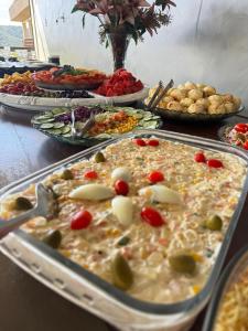 a buffet of food on a table with food at Cascata Boutique Hotel in Várzea da Palma