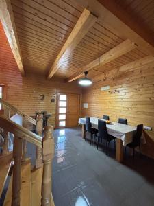 a large wooden room with a table and chairs at Casa Franch in Deltebre +9 photos