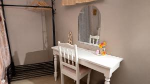 a bathroom with a white sink and a mirror at Casa LeValois - Hidden Garden Oasis in Port-Louis in Port Louis +14 photos