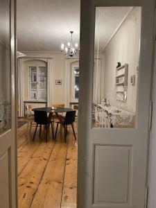 a room with a table and a dining room at Historisches Bürgerhaus Hartlschuster in Neufelden