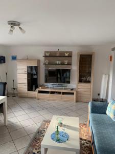 a living room with a couch and a table at Ferienwohnung Tina in Nettersheim