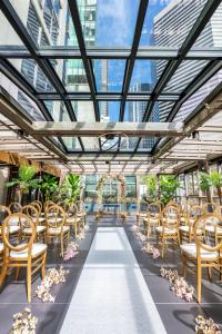 a row of chairs in a building with a ceiling at Hotel 1000, In The Unbound Collection By Hyatt in Seattle
