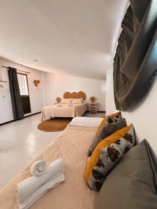 a bedroom with two beds in a room at Casa Almonte in Almonte