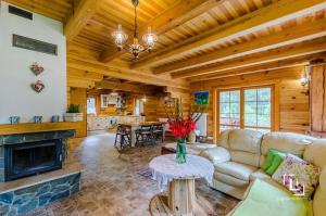 a living room with a couch and a fireplace at DOM w BORACH in Cekcyn