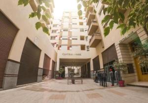 a group of people standing outside of a building at Parc app in Mohammedia