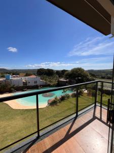 a view from the balcony of a house with a swimming pool at Cascata Boutique Hotel in Várzea da Palma