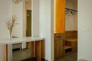 a bathroom with a counter and a dressing room at Sunset Serenity in Himare +159 photos