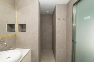 a bathroom with a shower and a sink at Milva Apartments in Kos +224 photos
