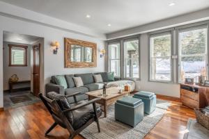 a living room with a couch and a table at Snowcreek V 883 in Mammoth Lakes +28 photos