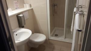 a bathroom with a toilet sink and a shower at Stella Maris in Stella-Plage +15 photos