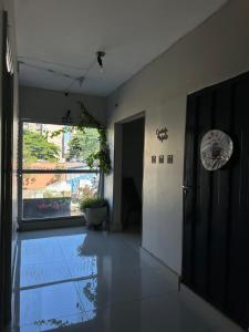 an empty hallway with a large window in a building at Hotel Flor D Liz in Goiânia