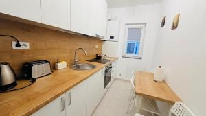 a kitchen with a sink and a counter top at Diana Apartments in Arad