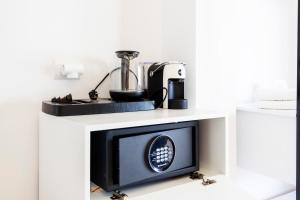 a microwave oven on a counter with a blender on it at Ionio Blue in Himare